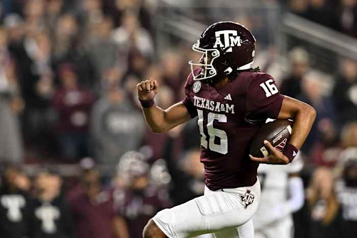Nov 11, 2023; College Station, Texas, USA; Texas A&M Aggies quarterback Jaylen Henderson (16) runs the ball into the end zone for a touchdown during the first quarter against the Mississippi State Bulldogs at Kyle Field.